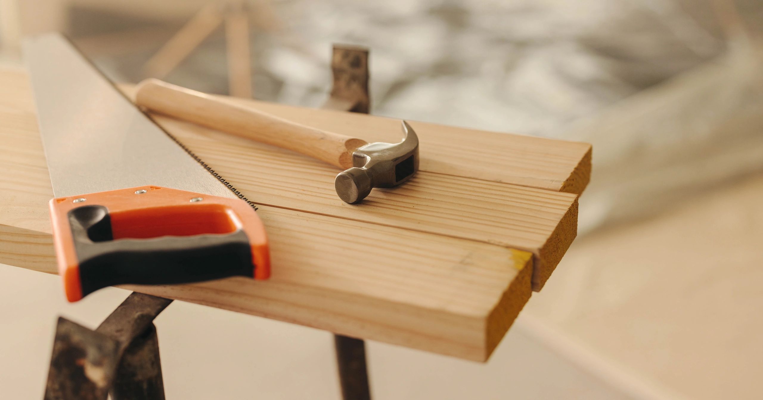 Assorted woodworking tools on a wooden surface