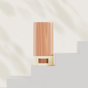 Small live-edge wood side table/stool photographed in a warm studio setting