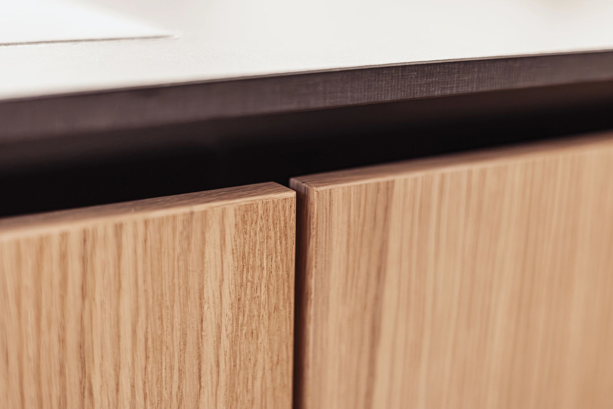 Detail of modern wood cabinetry with vertical grain
